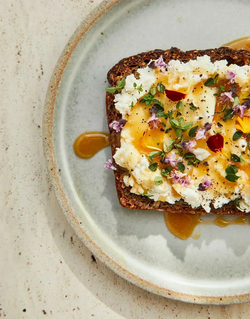 Goat Cheese Toast with Mānuka Honey, Herbs and Petals