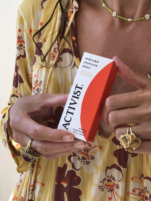 Gabrielle Mirkin holding ACTIVIST Manuka Immune Elixir